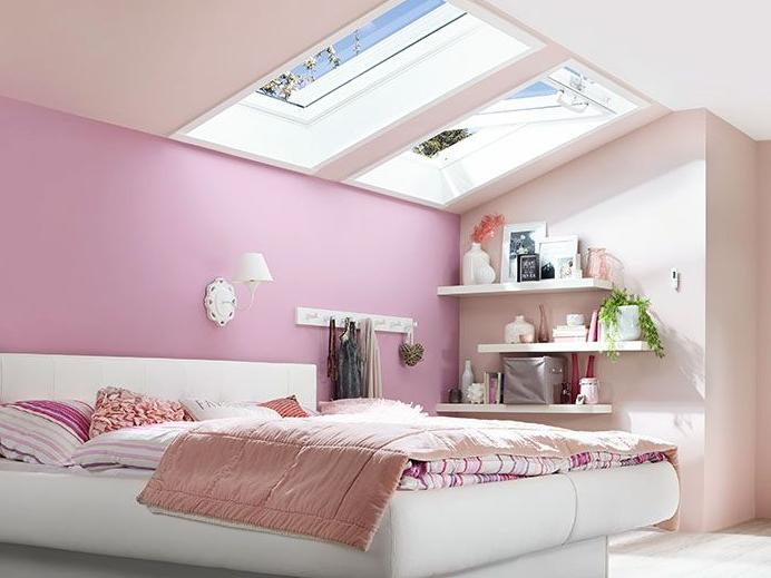 Two RotoQ swing windows flood a bedroom with plenty of light