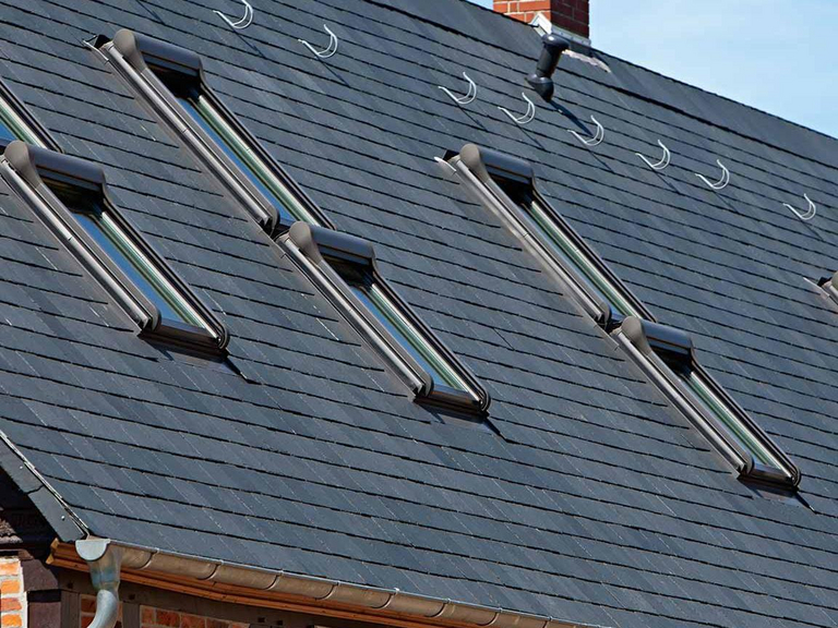 Slate roof with several roof windows